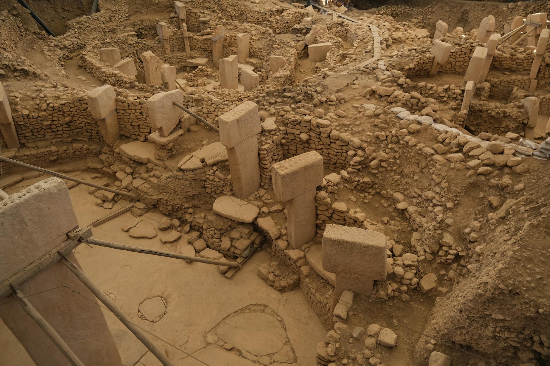 Aerial view of the ancient ruins at Gobekli Tepe, showcasing stone pillars.