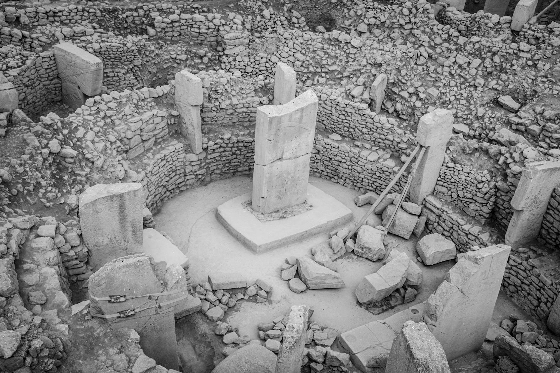 Aerial view of Göbekli Tepe ancient ruins showcasing stone pillars and circular structures.