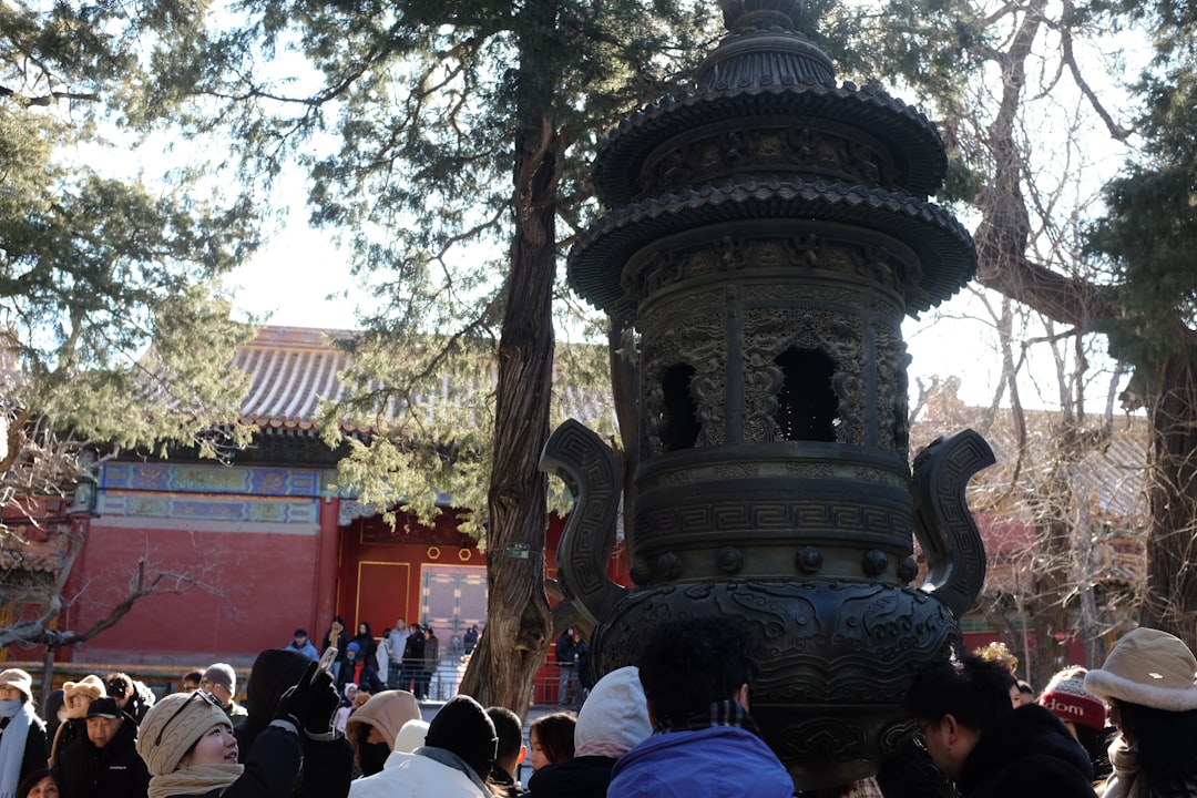 Ornate bronze incense burner in a temple courtyard