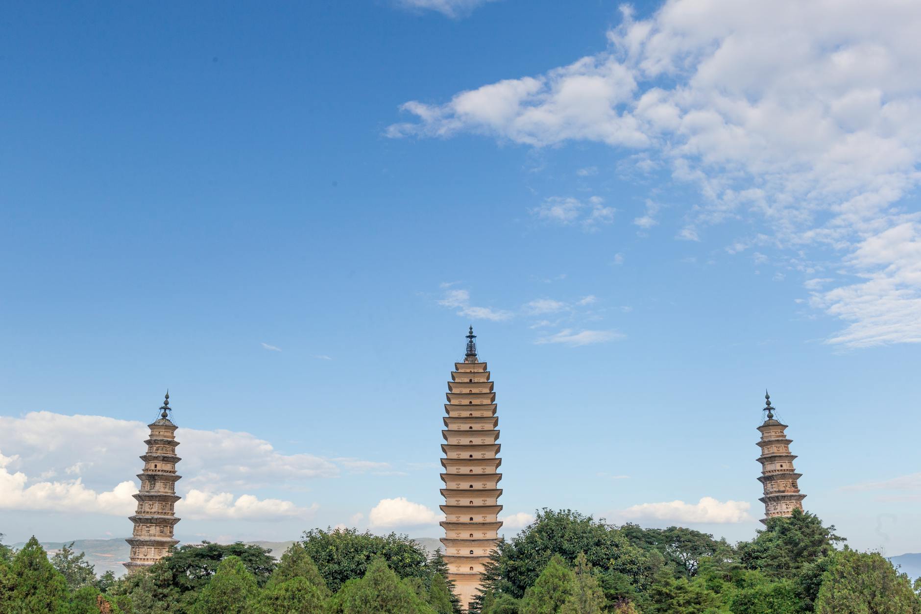The iconic Three Pagodas at Chongsheng Temple against a clear blue sky, Yunnan, China.