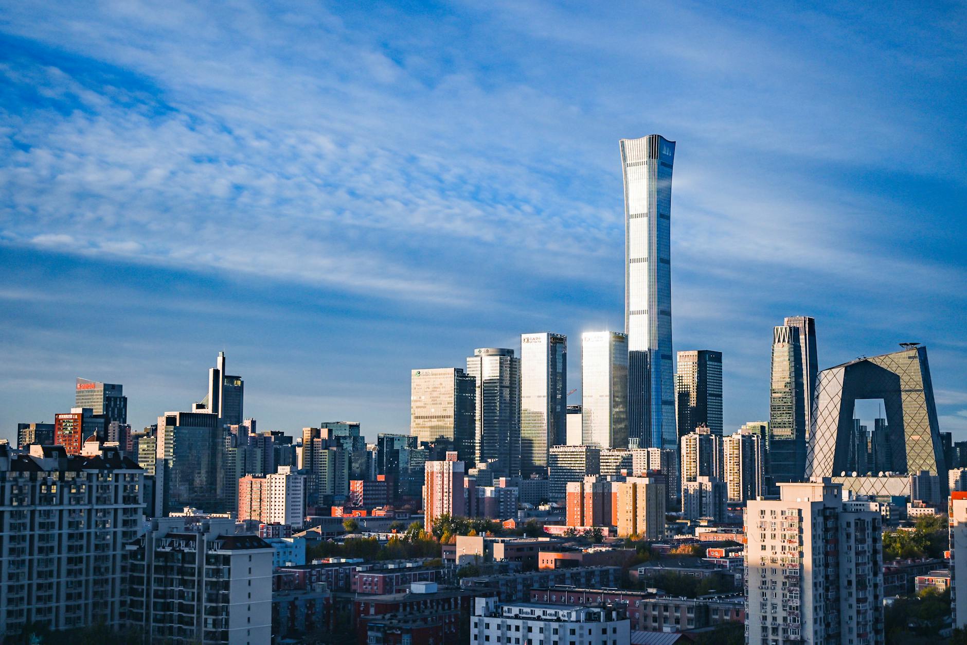 Stunning view of Beijing's skyline featuring the China Zun Tower under a vibrant blue sky.
