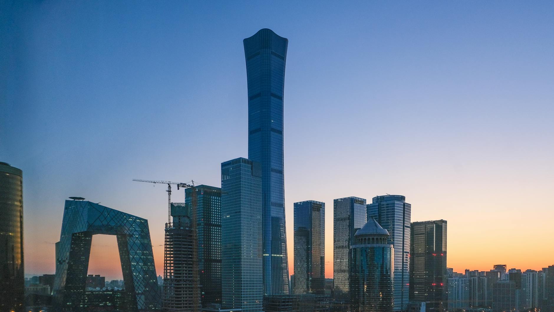 Stunning view of Beijing's skyline with iconic skyscrapers at sunset.
