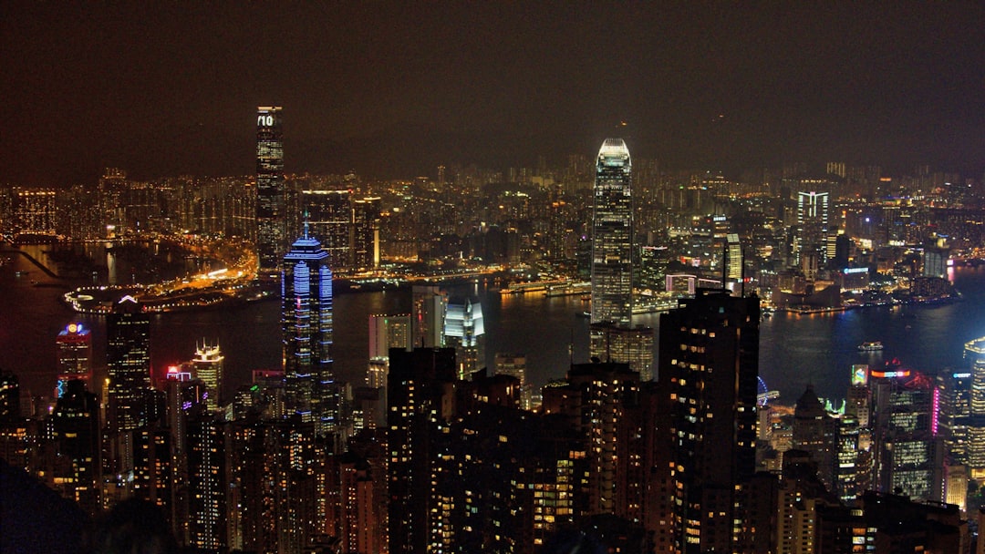 a view of a city at night from the top of a hill