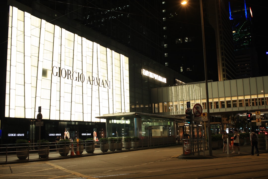Giorgio armani building illuminated at night.