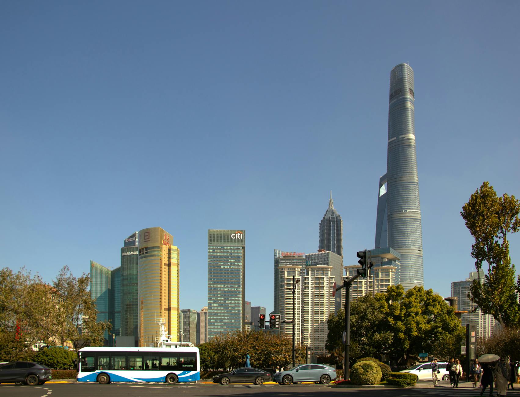 Panoramic cityscape of Shanghai's iconic skyscrapers with clear skies.