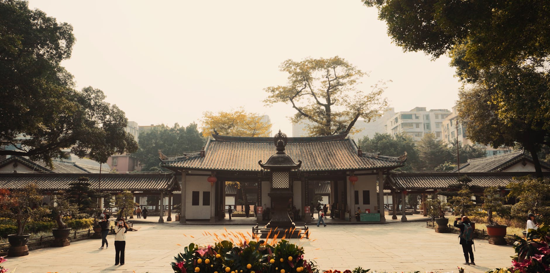 A tranquil scene at Guangxiao Temple with visitors exploring the historic site.