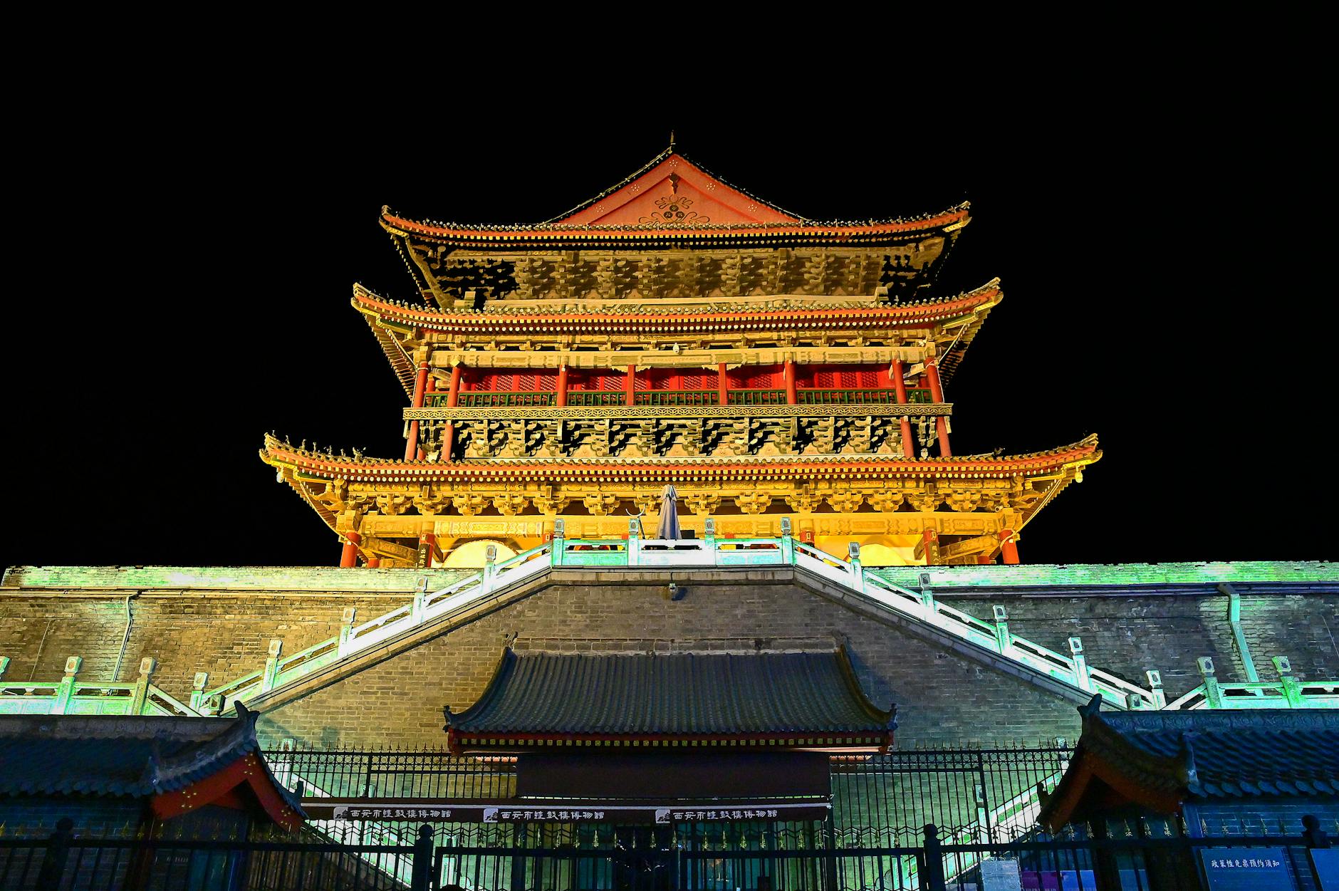 A stunning night view of the famous Bell Tower in Xi'an, China, beautifully lit against the night sky.