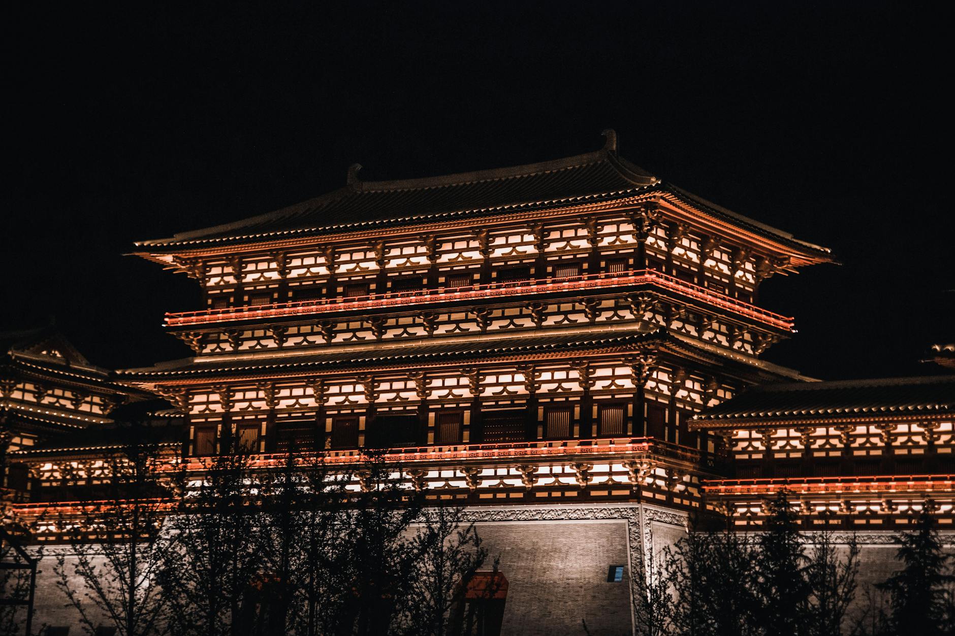 Stunning night view of traditional Chinese architecture beautifully lit.