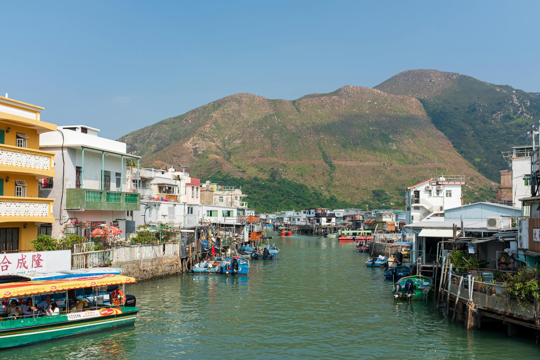 Charming view of Tai O Fishing Village with stilt houses and boats in New Territories, Hong Kong.