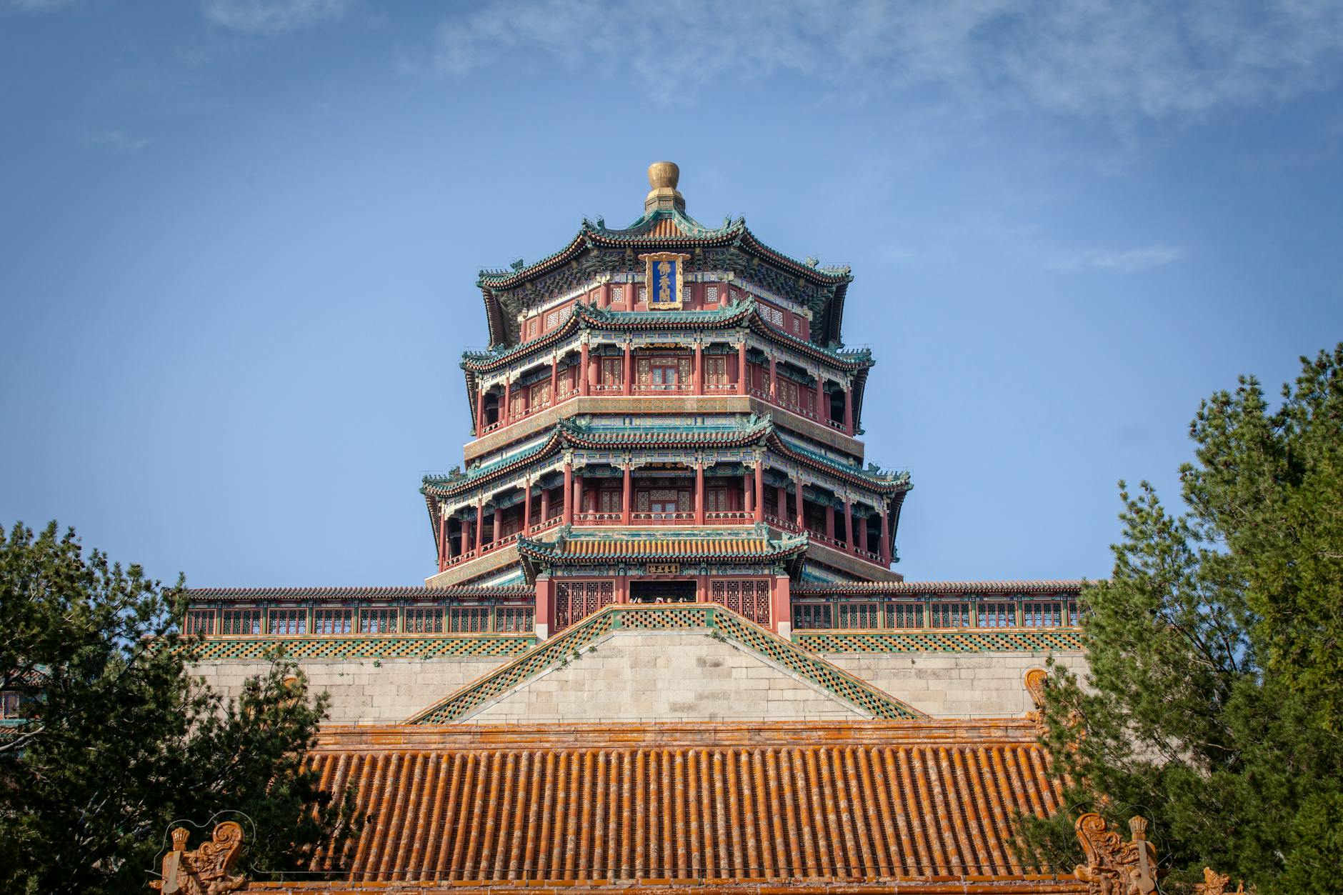 Low angle view of the Summer Palace's Tower of Buddhist Incense in Beijing, China, under a blue sky.