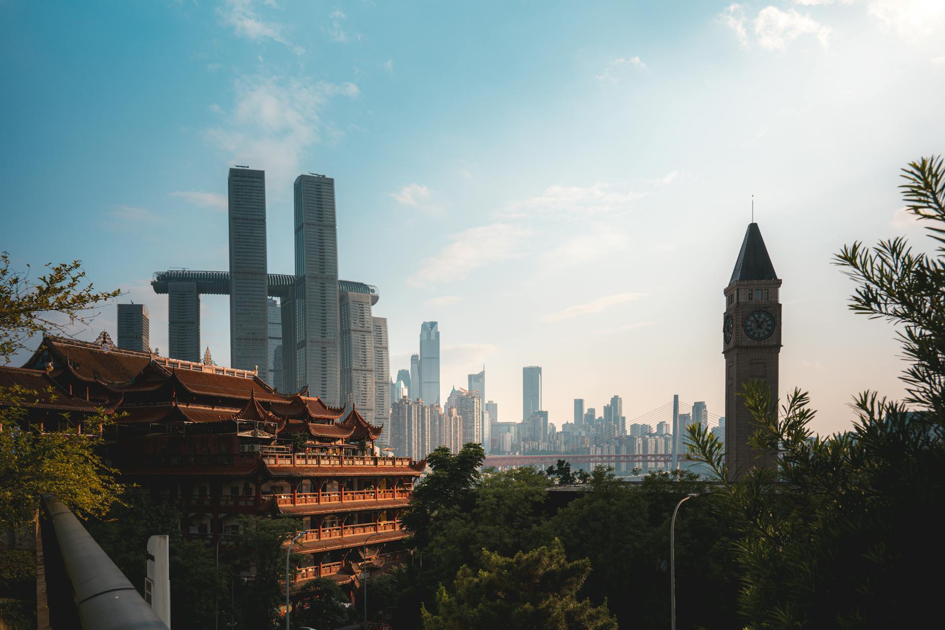 Skyline of Chongqing showcasing modern skyscrapers and traditional architecture under a clear sky.