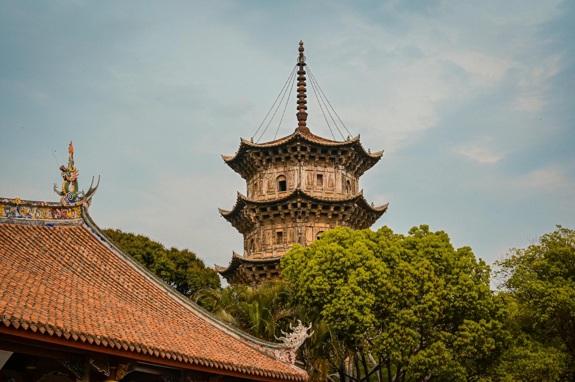 Beautiful view of the Kaiyuan Temple pagoda surrounded by lush greenery in Quanzhou, China.