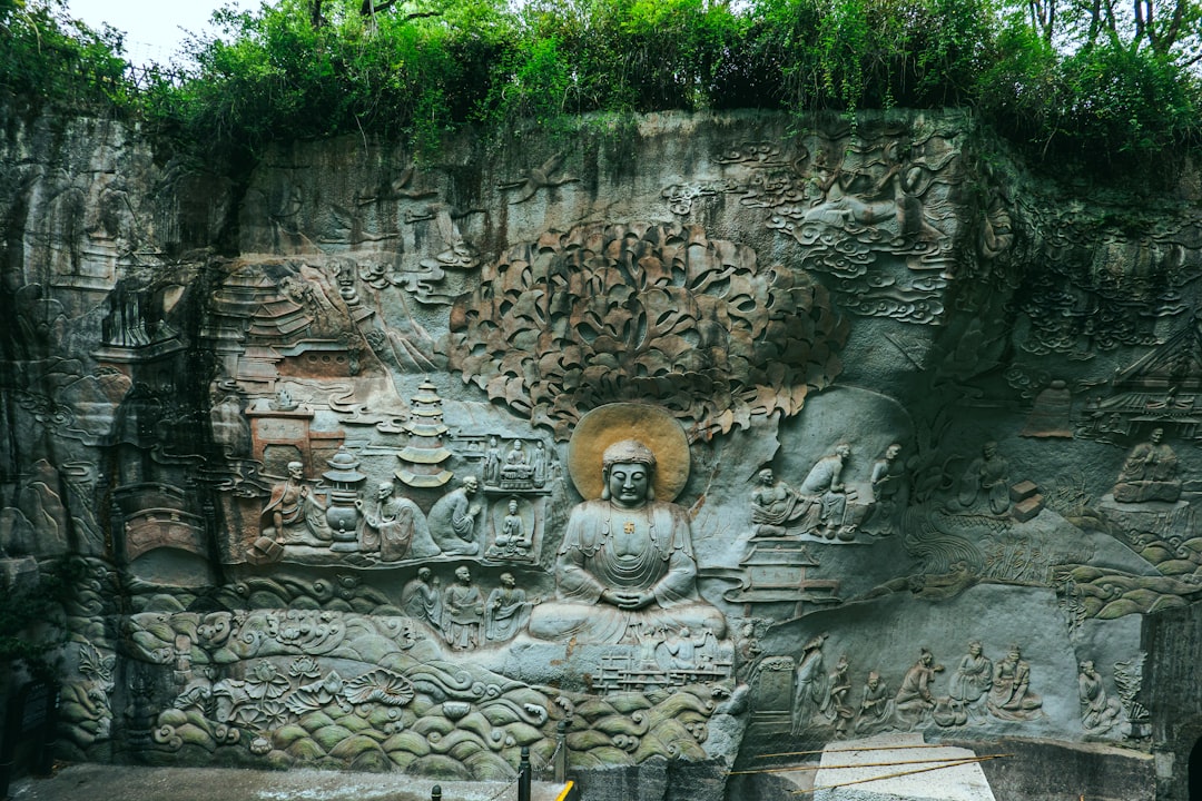 A large buddha statue carved into rock.
