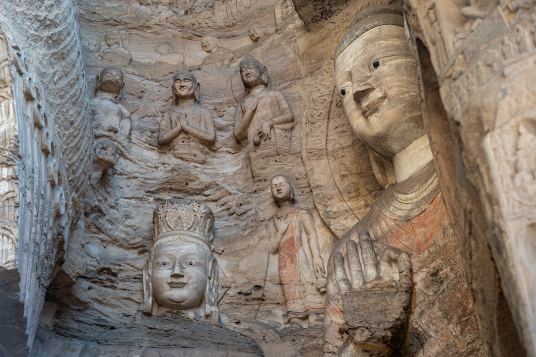 Ancient buddhist carvings in a rock face