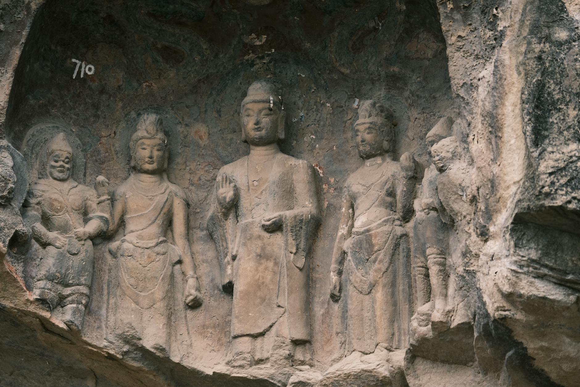Historic Buddhist rock carvings showcasing ancient art and craftsmanship.