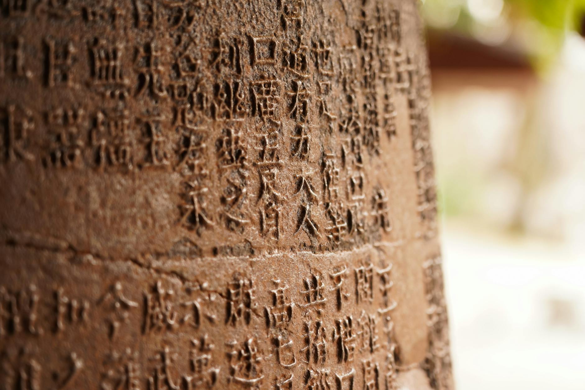 Close-up of ancient Chinese characters carved into a stone in Guilin, China.