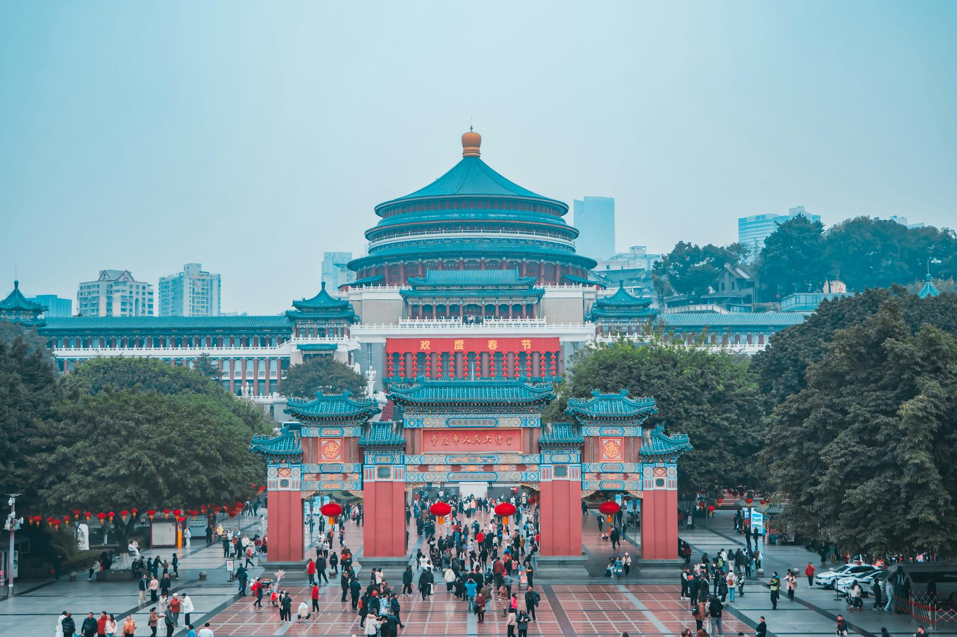 Captivating view of Chongqing's Great Hall of the People with vibrant city life.