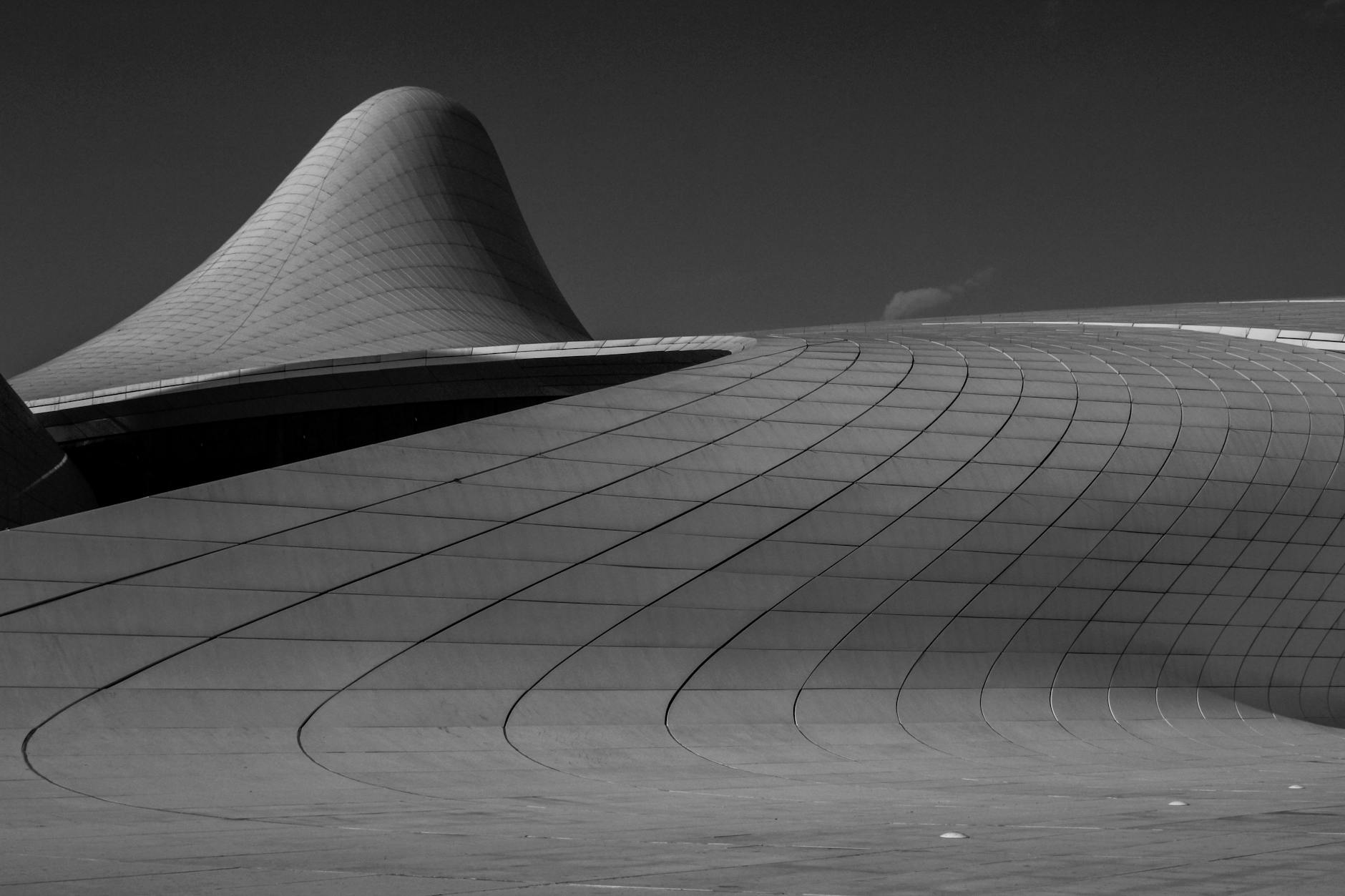 Black and white photo showcasing the futuristic design of Heydar Aliyev Center, Baku.