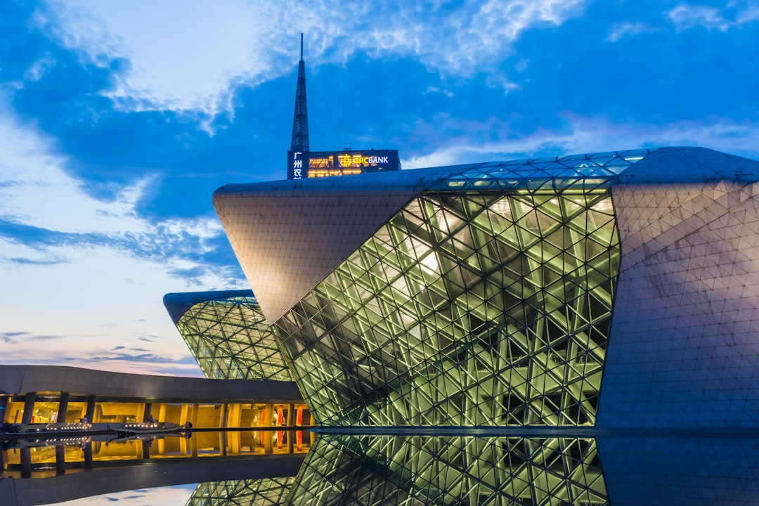 gray and green structure under blue sky