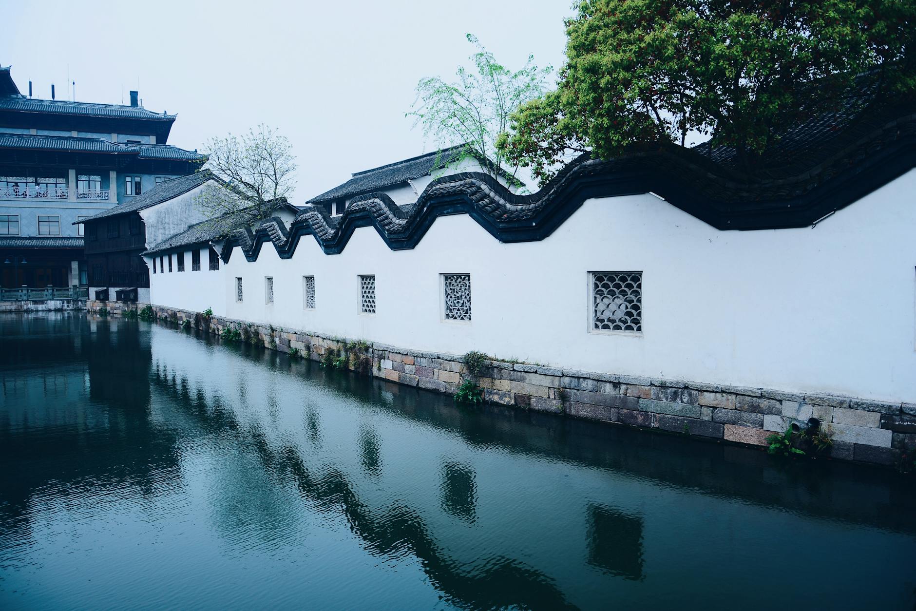 Beautiful traditional Chinese architecture reflected in a tranquil canal.