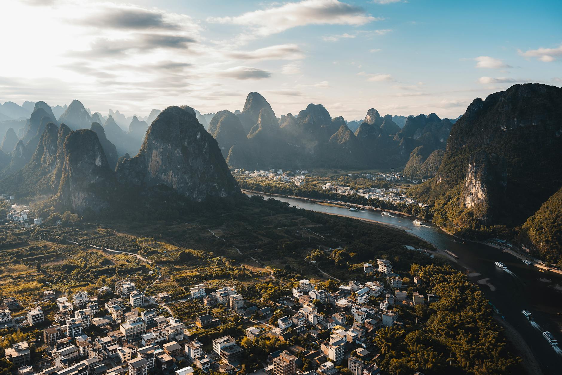 Discover the breathtaking aerial view of karst mountains and lush countryside in Guilin, Guangxi, China.