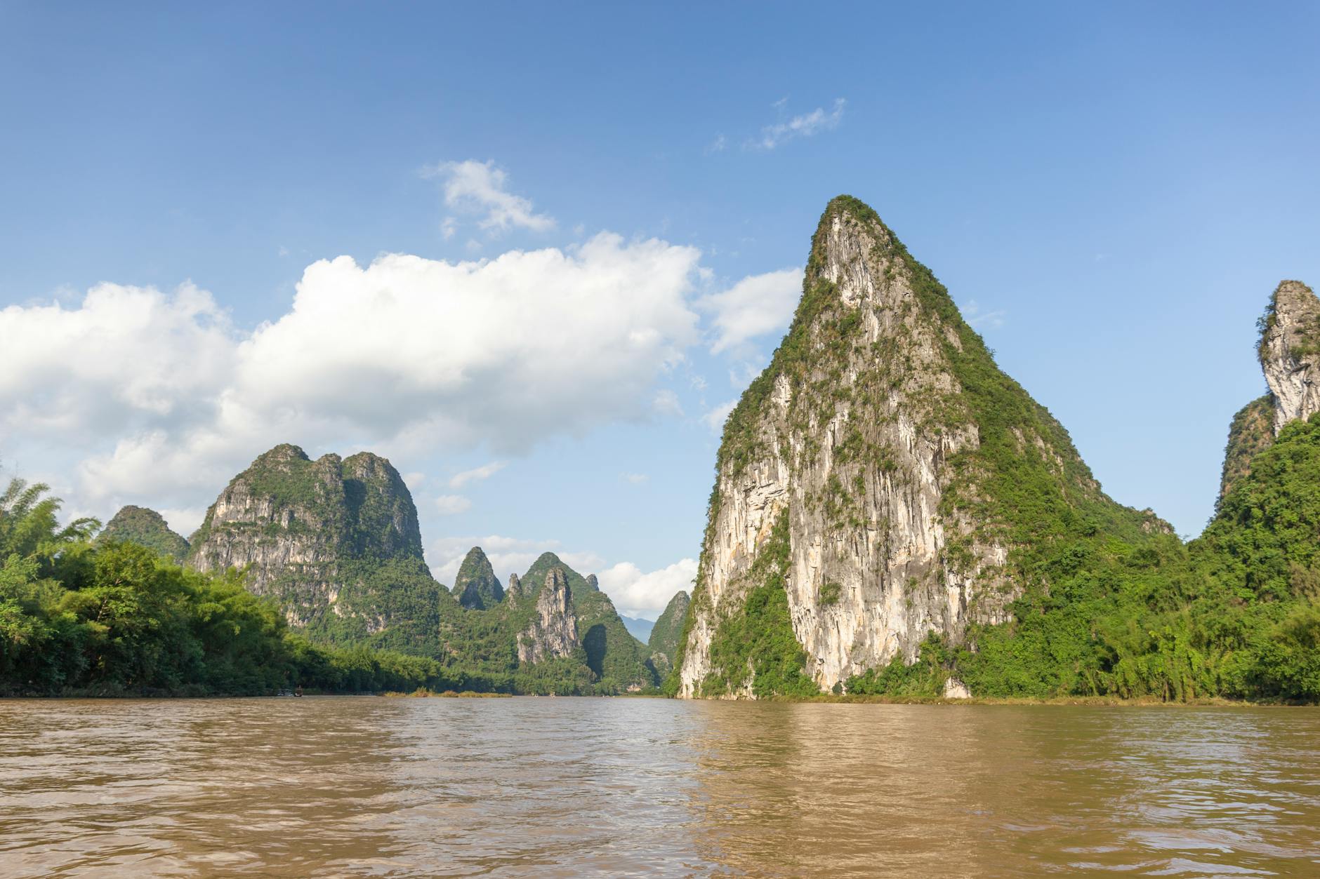 A breathtaking scenic view of karst mountains reflecting on the Li River in Yangshuo, Guangxi, China.