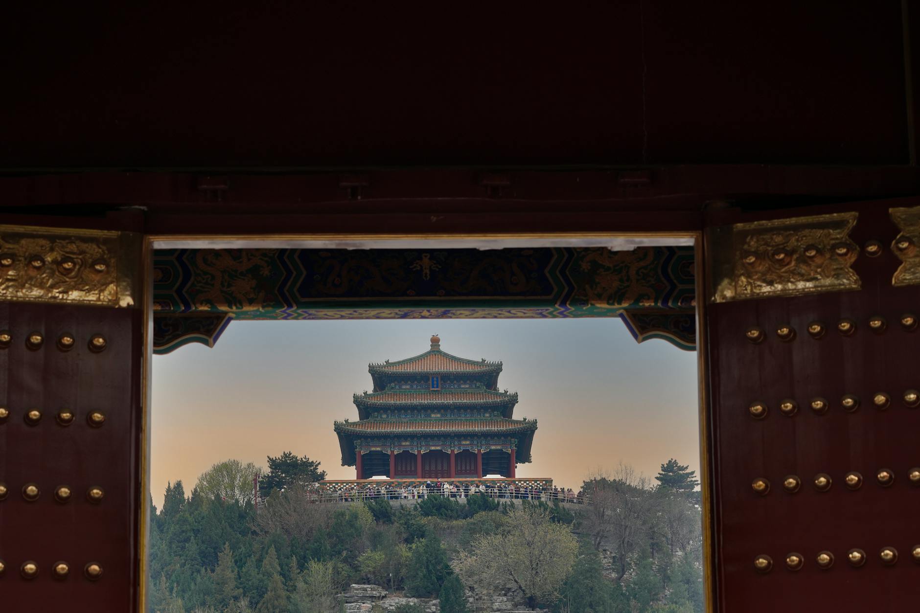 Jingshan Park Pavilion seen through the ancient Forbidden City gate, Beijing.