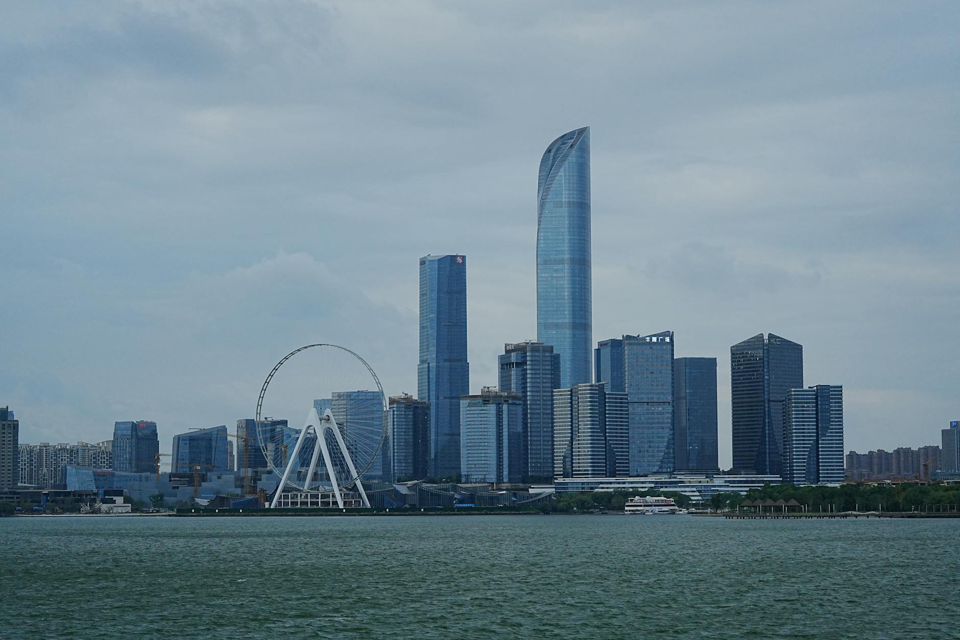 View of Suzhou skyline featuring the Riesenrad Ferris Wheel by Jinji Lake.