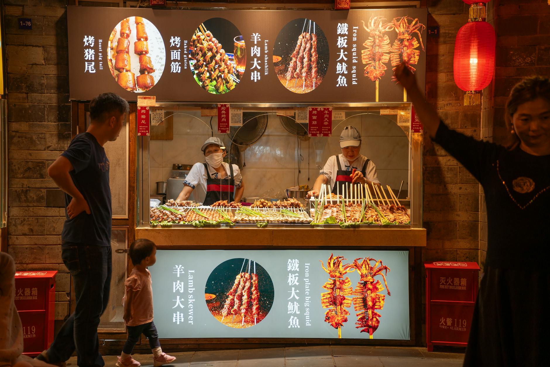 Delicious street food stall with variety of skewers in Chengdu's night market, China.