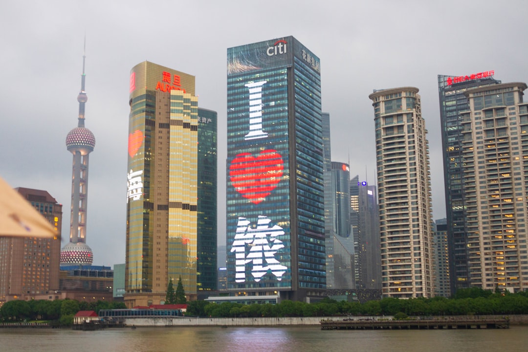 A body of water with buildings in the background