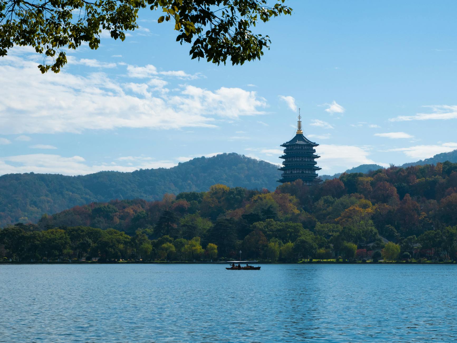 Capture of Leifeng Pagoda amidst autumn foliage at West Lake, Hangzhou, China.