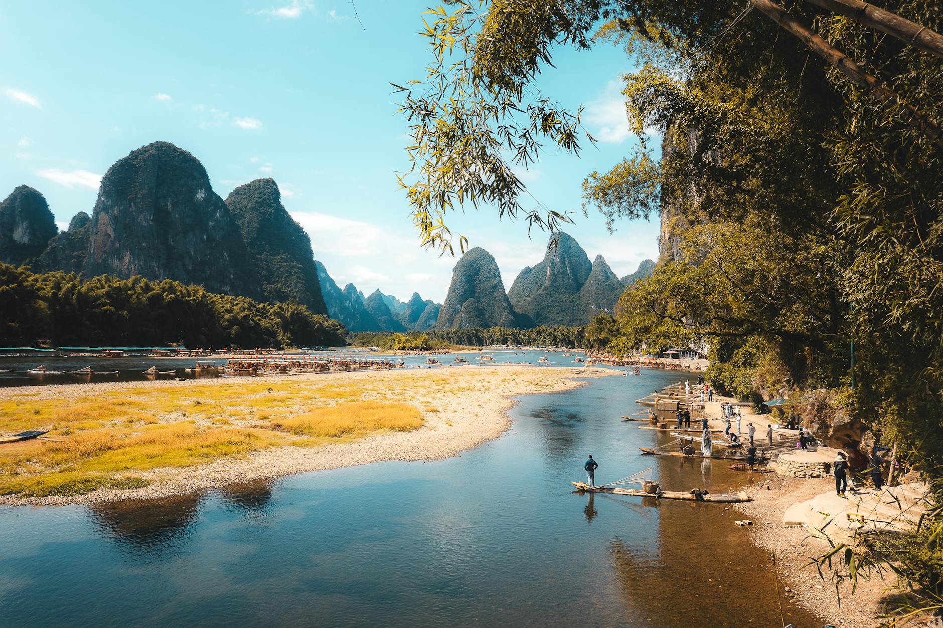 Stunning view of Li River with karst mountains and bamboo rafts in Guilin, China.