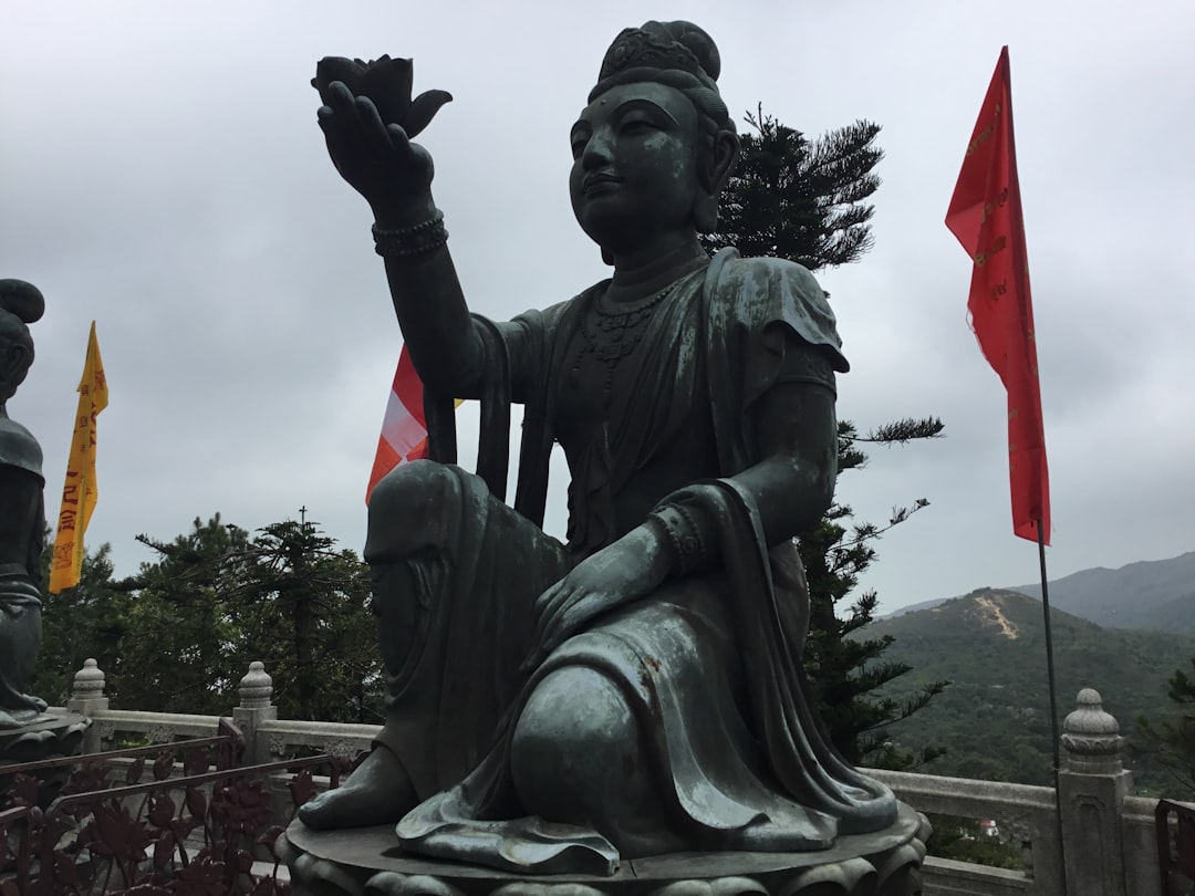 statue of man holding flag of america