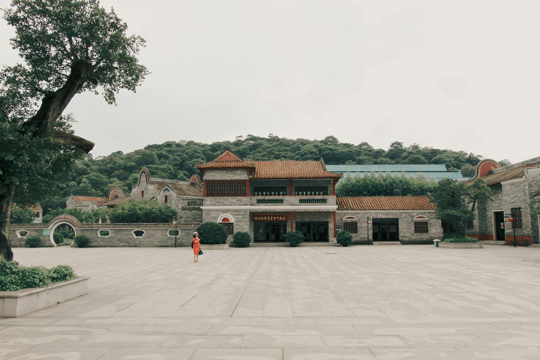 Explore this historic Asian temple surrounded by serene trees and traditional architecture.