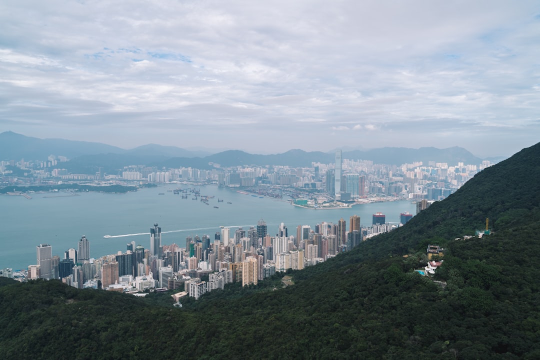 Victoria Peak on a hill by a body of water