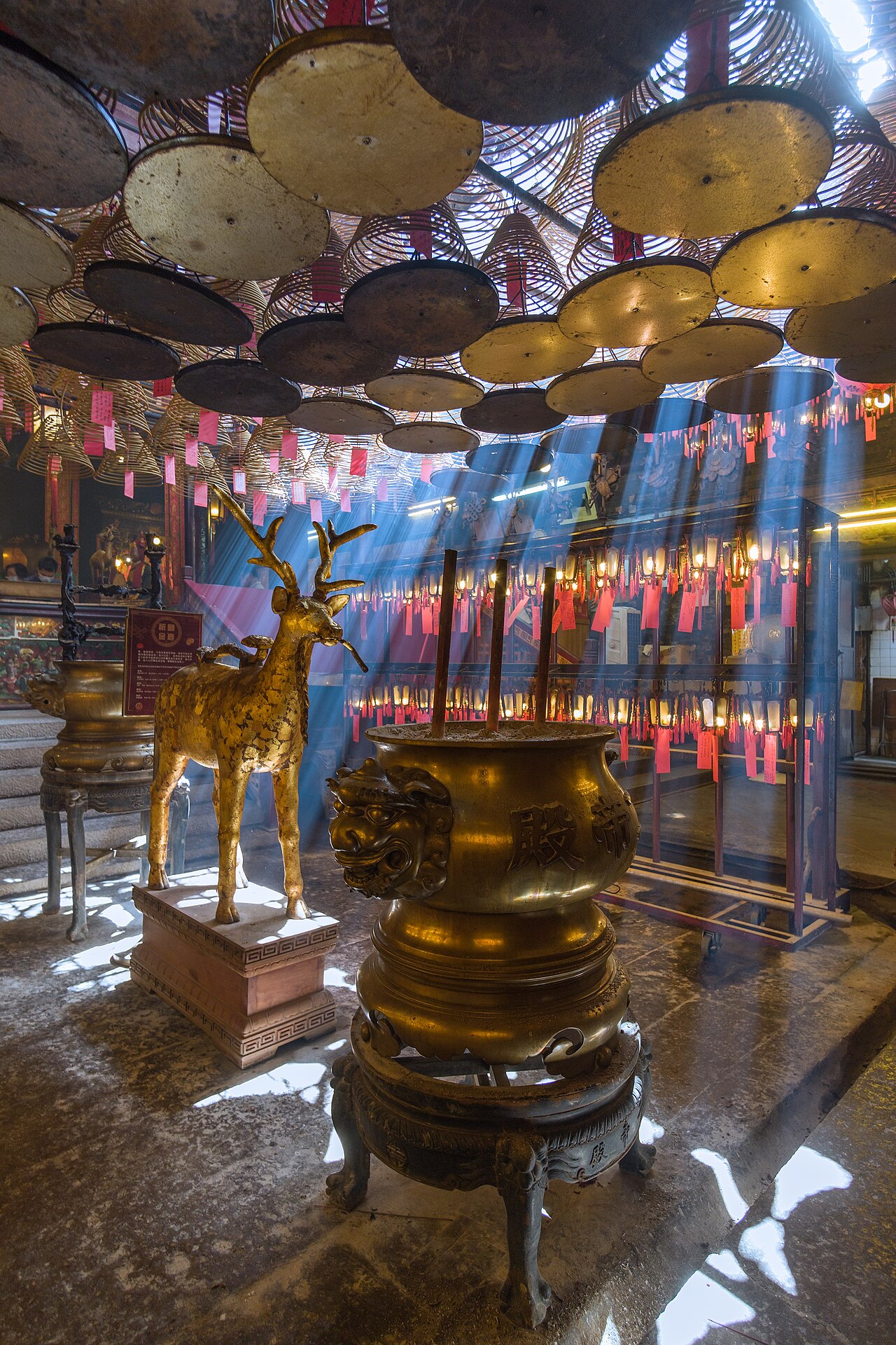 Light shafts beaming through the incense smoke in Hollywood road's Man-Mo Temple, Sheung-Wan, Hong-Kong.