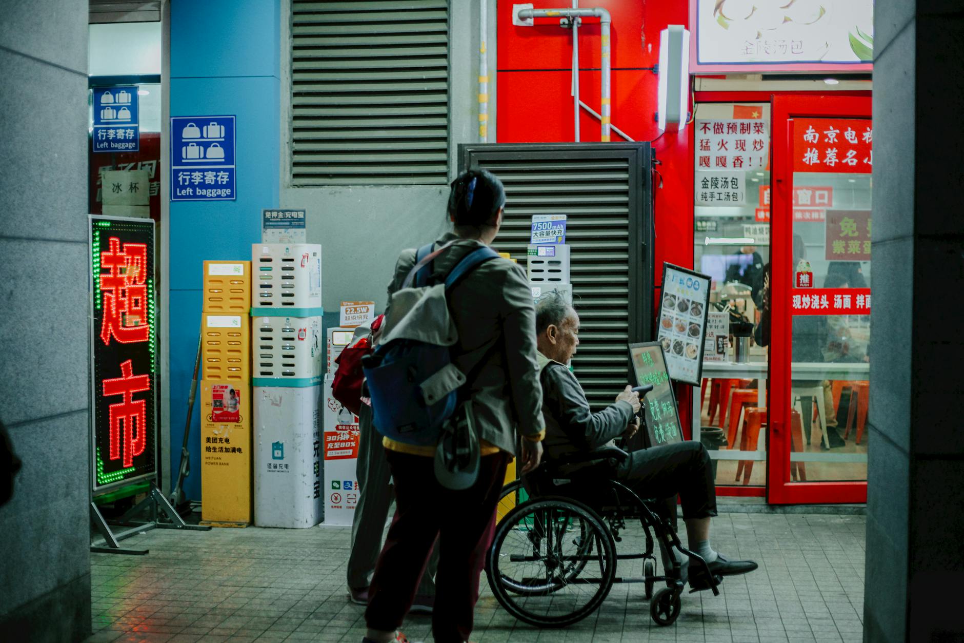 Candid shot capturing daily life on a bustling street in Nanjing, China.