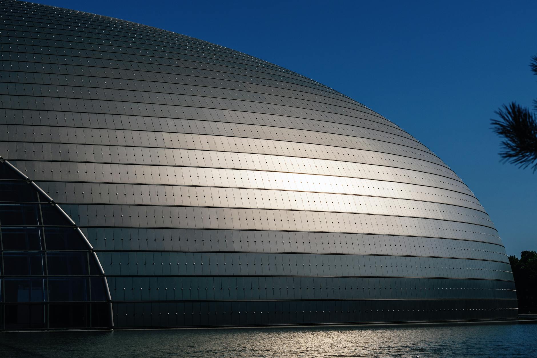 Exterior view of the futuristic dome architecture reflecting sunlight, Beijing, China.