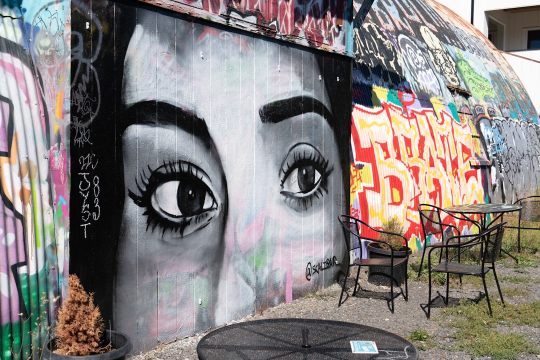 Graffiti mural of a woman's eyes on a wall