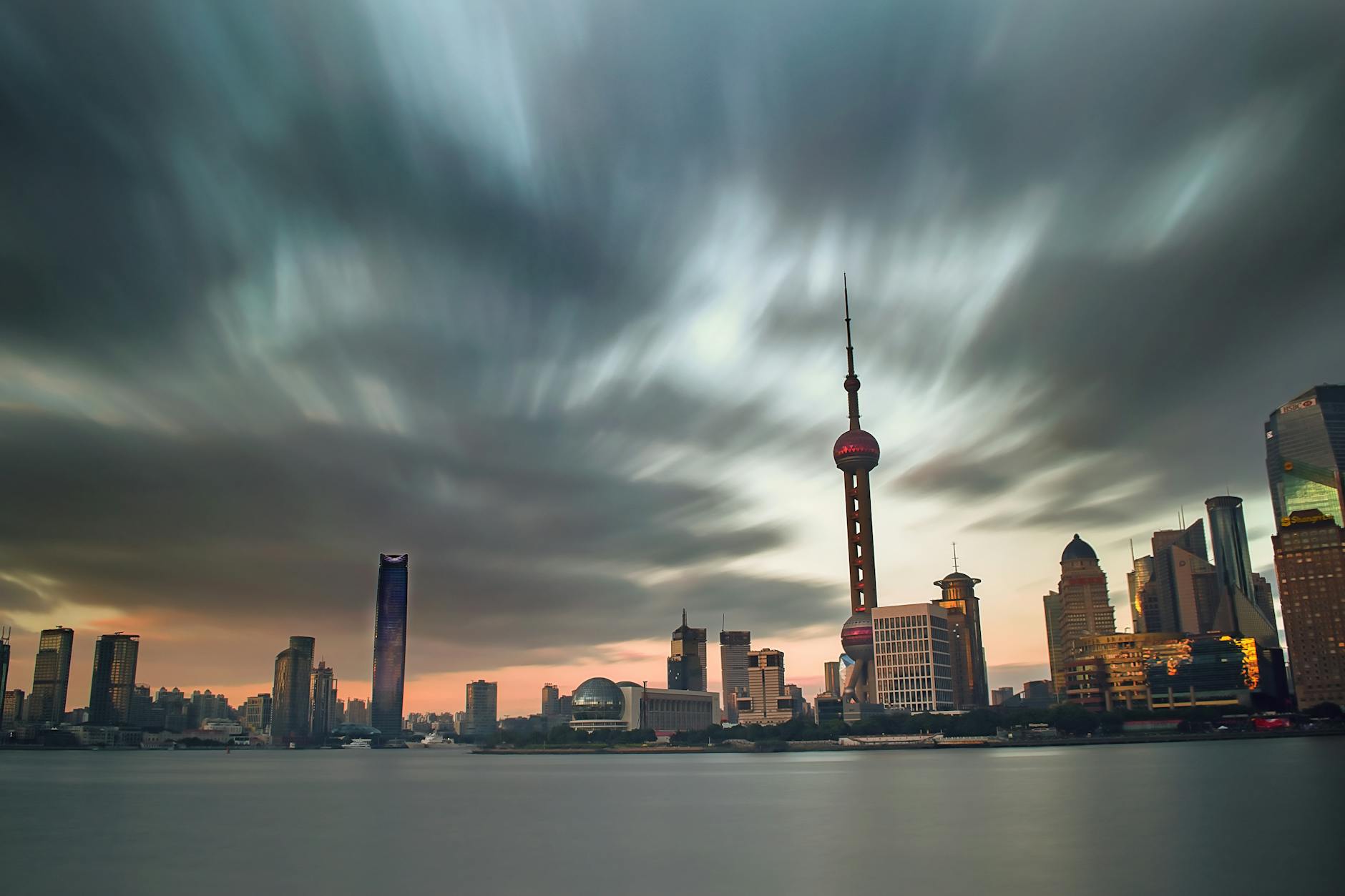 Stunning view of Shanghai skyline at dusk with the iconic Oriental Pearl Tower prominently featured.