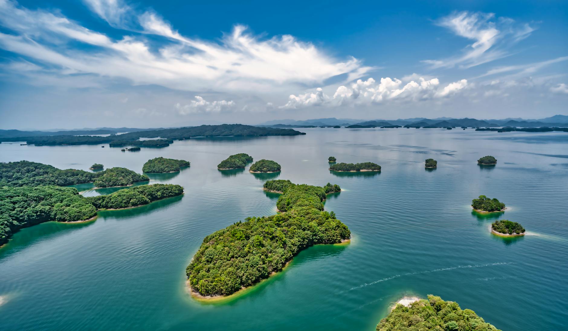 Explore the stunning islands of Qiandao Lake, a serene landscape in Zhejiang, China.