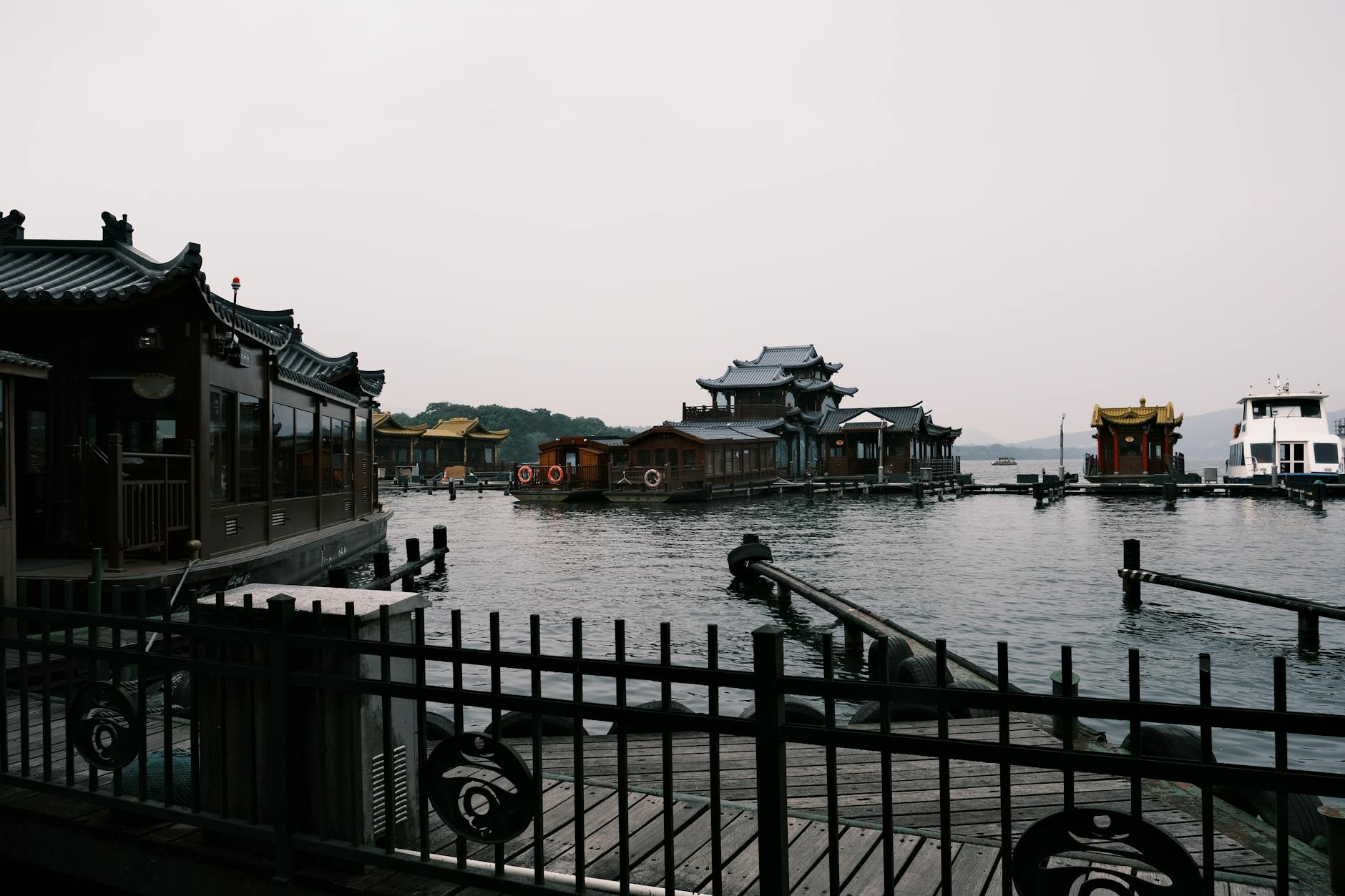 Serene view of traditional floating pagodas on West Lake, Hangzhou, China, capturing cultural architecture.