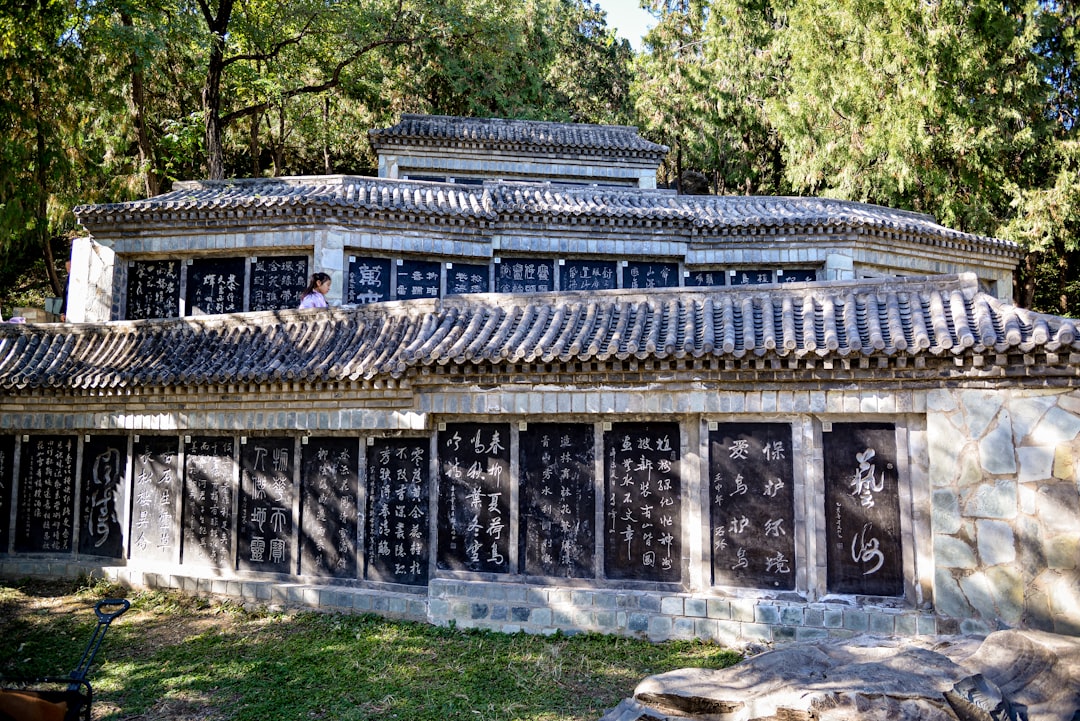 Ornate building with tiled roof and carved walls.