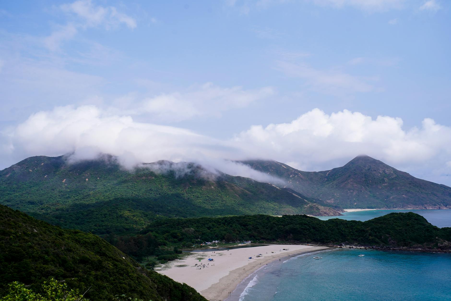 A breathtaking aerial view of the lush landscape and serene waters at Tai Long Wan Bay, Hong Kong.
