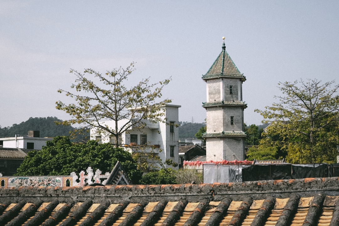 A tall clock tower towering over a city