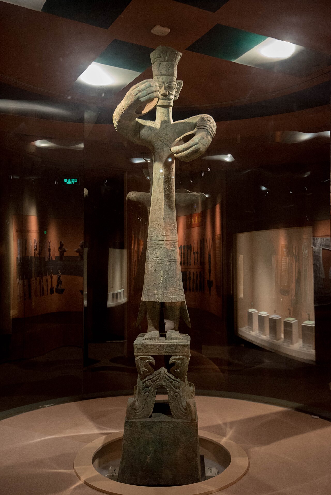"This standing figure is obviously the Most Important Person, therefore it stands to reason that he represents a 'high priest' or leader of religious practice.