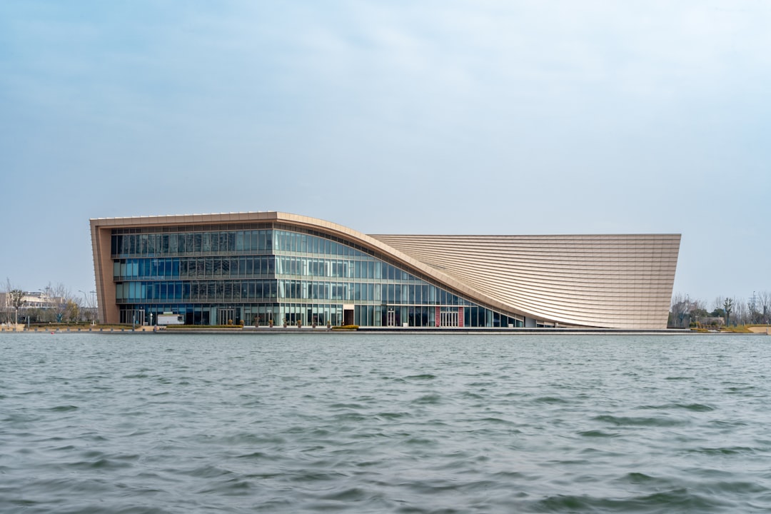 Modern building with curved facade on the water