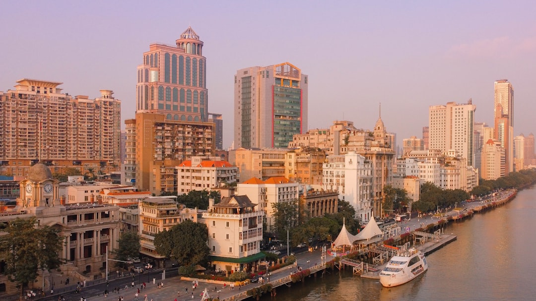 a river with a bunch of buildings in the background