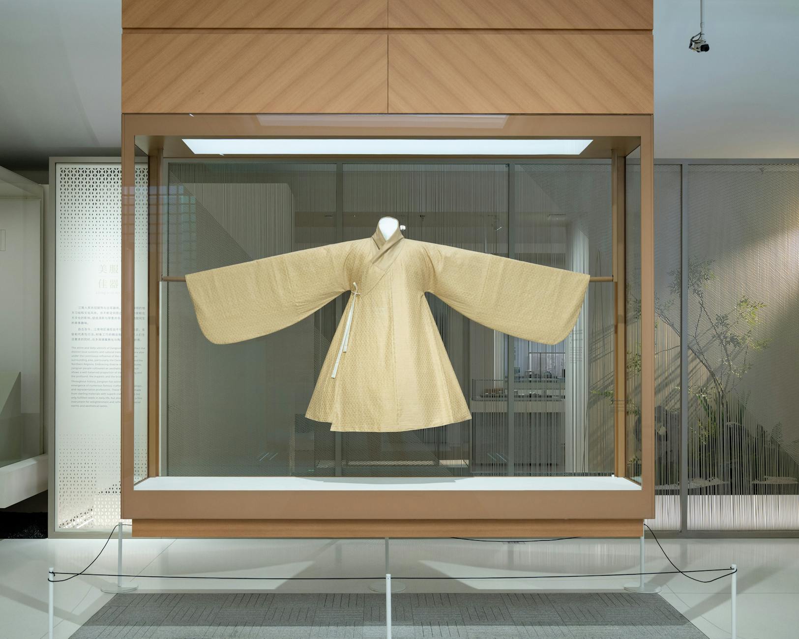 Modern display of a traditional Korean Hanbok inside a Shanghai museum.