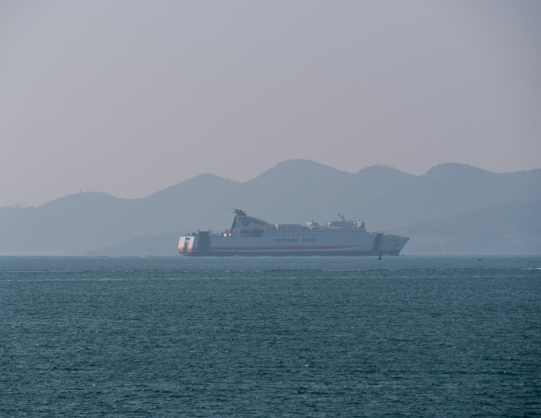 A large boat in the middle of a large body of water